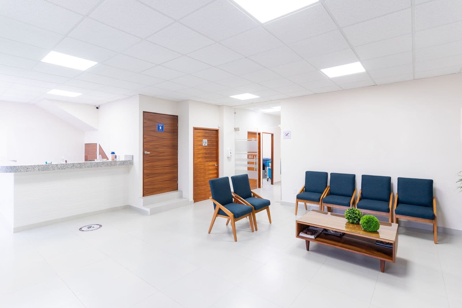 Bright clean medical waiting room, modern seating, no people/brand